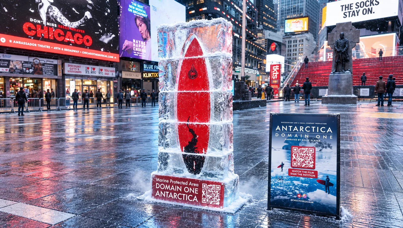 A red surfboard encased in a block of ice stands in Father Duffy Square in Times Square beside an Antarctica - Domain One campaign sign.