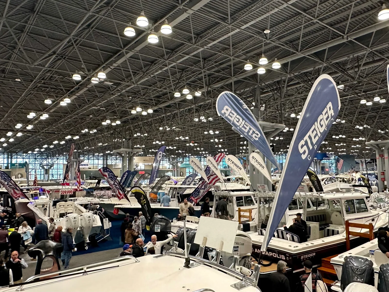 Motorboats and exhibitor banners fill the Javits Center exhibition floor