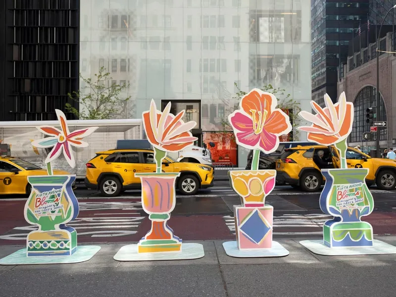 A colorful floral sculpture from Fifth Avenue Blooms along a Manhattan sidewalk