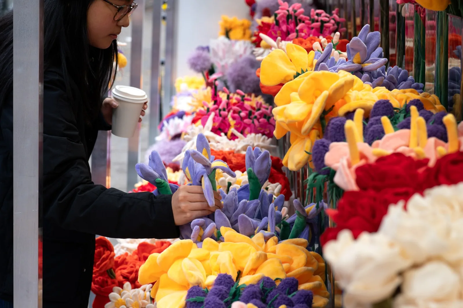 Rows of colorful plush flowers fill Cj Hendry's permanent SoHo shop