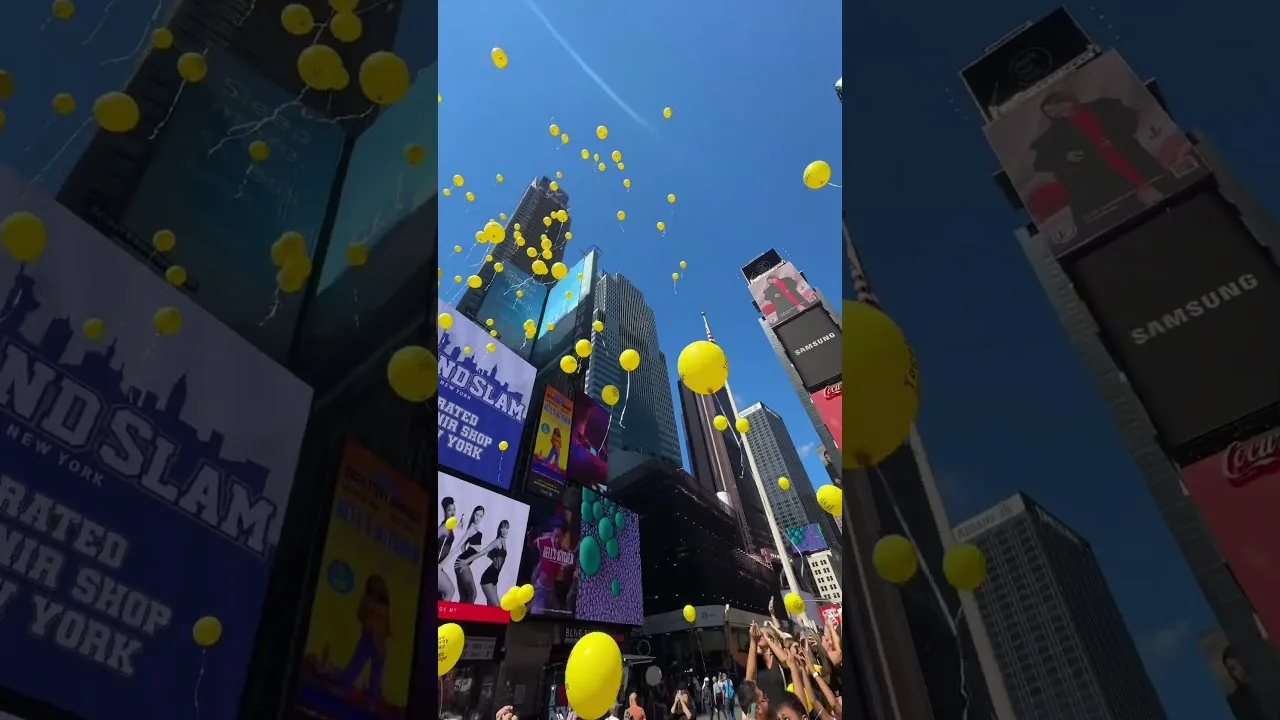 Releasing balloons into the Air at Times Square New York City thumbnail