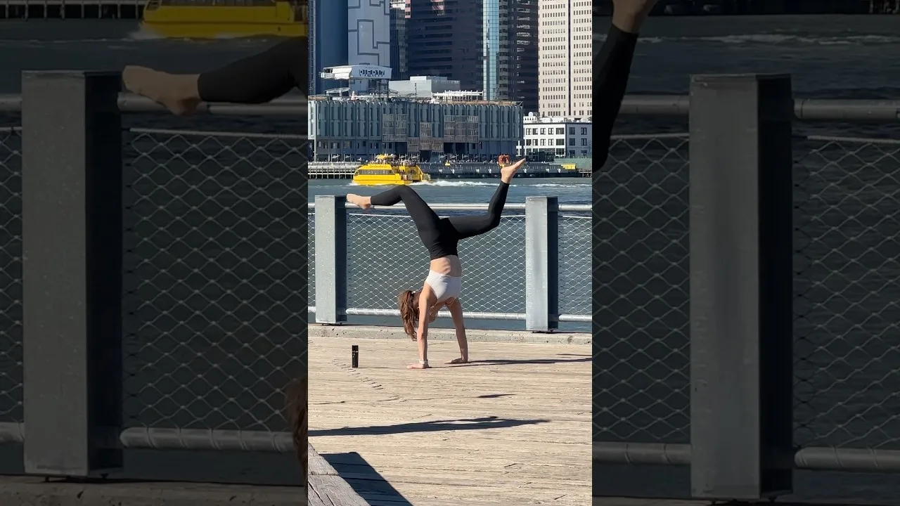 Girl Balancing Yoga Act at Brooklyn Bridge Park New York City thumbnail