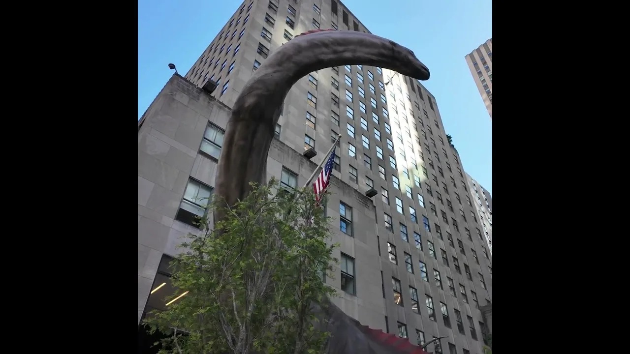 The Giant Titanosaurus life-like dinosaur at Rockefeller Center New York City thumbnail