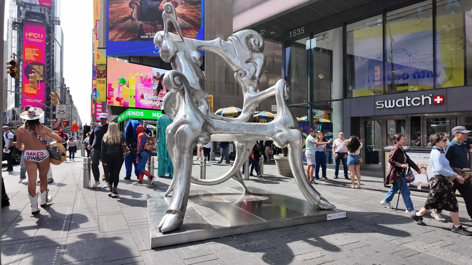 Iván Tovar's monumental silver chair sculpture stands on a Times Square pedestrian plaza