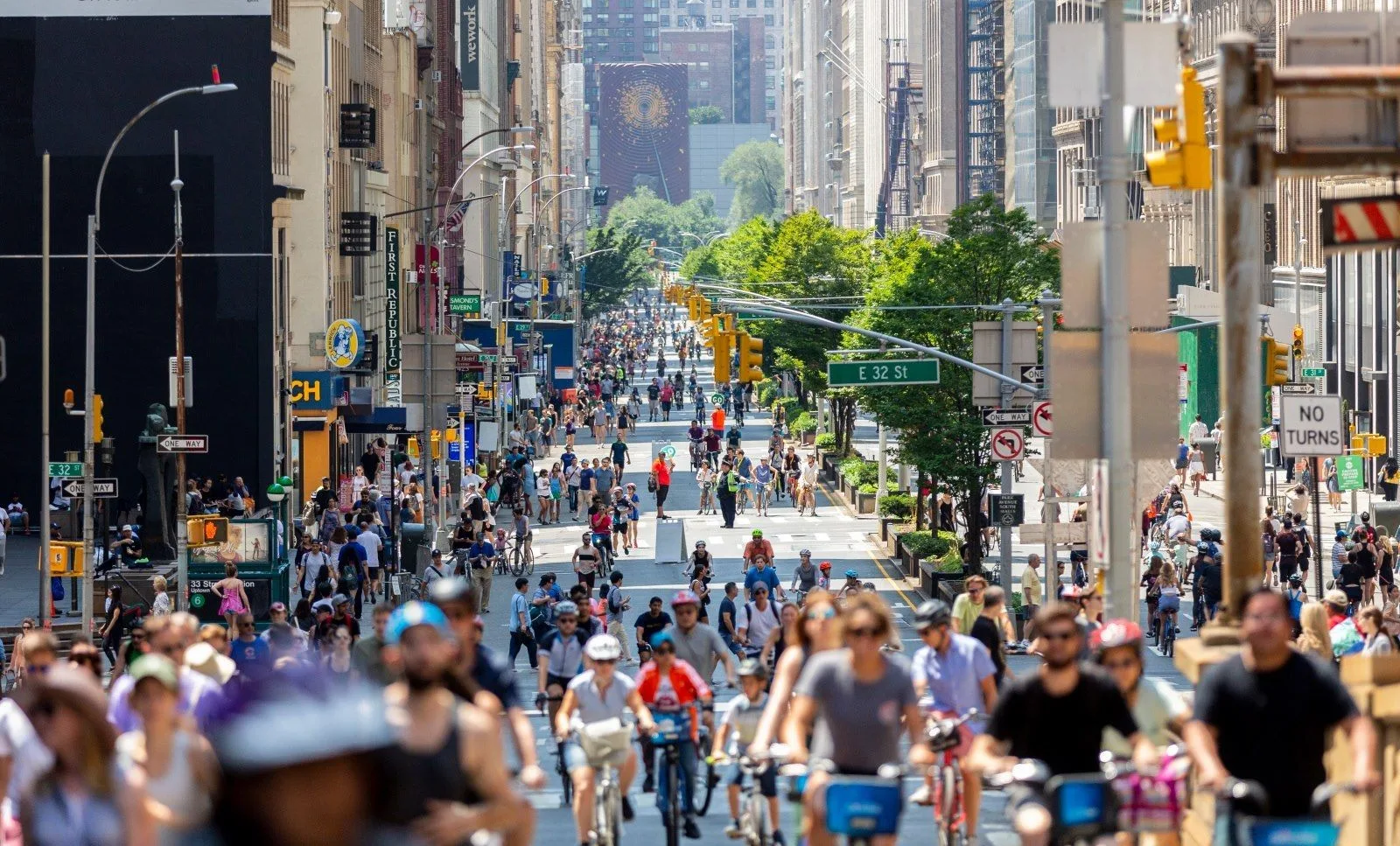 Cyclists and pedestrians fill a car-free Park Avenue near East 32nd Street