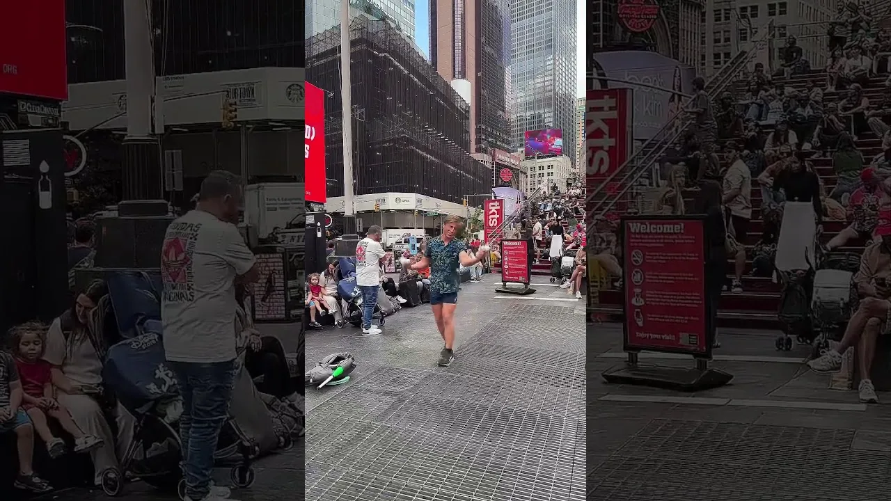 A juggler is showing off his skills at Times Square New York City thumbnail