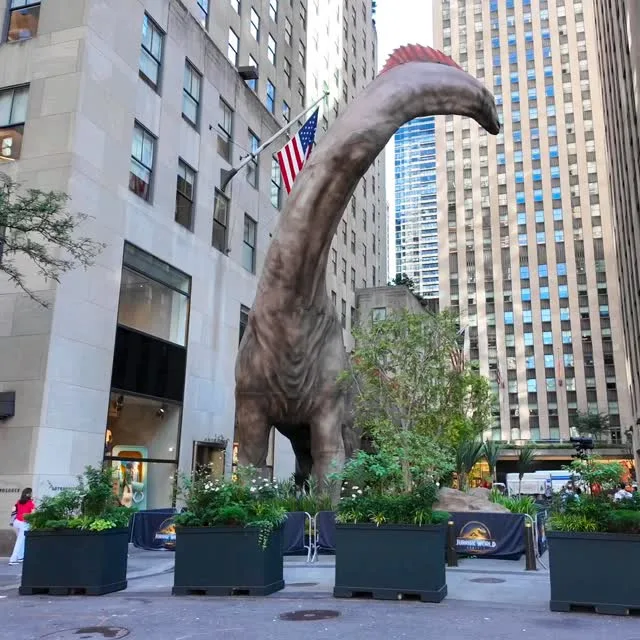A life‑sized, 60‑foot Titanosaurus now looms over Rockefeller Center—from June 24 to July 5, 2025—in celebration of the new Jurassic World: Rebirth release. Instagram preview