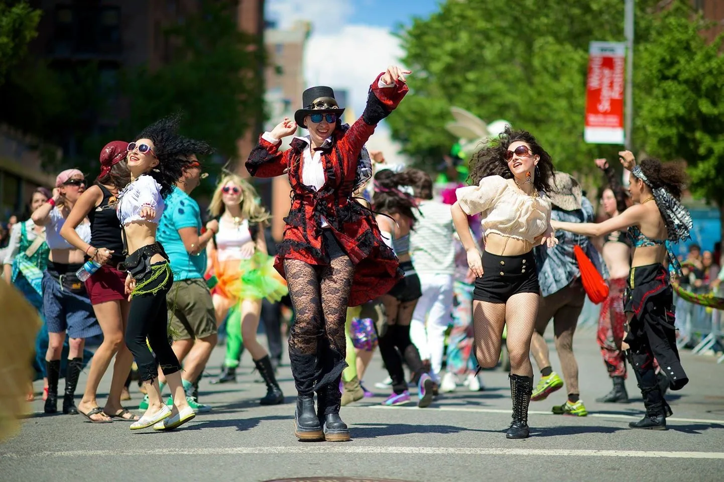 Costumed dancers perform in the middle of a Manhattan street
