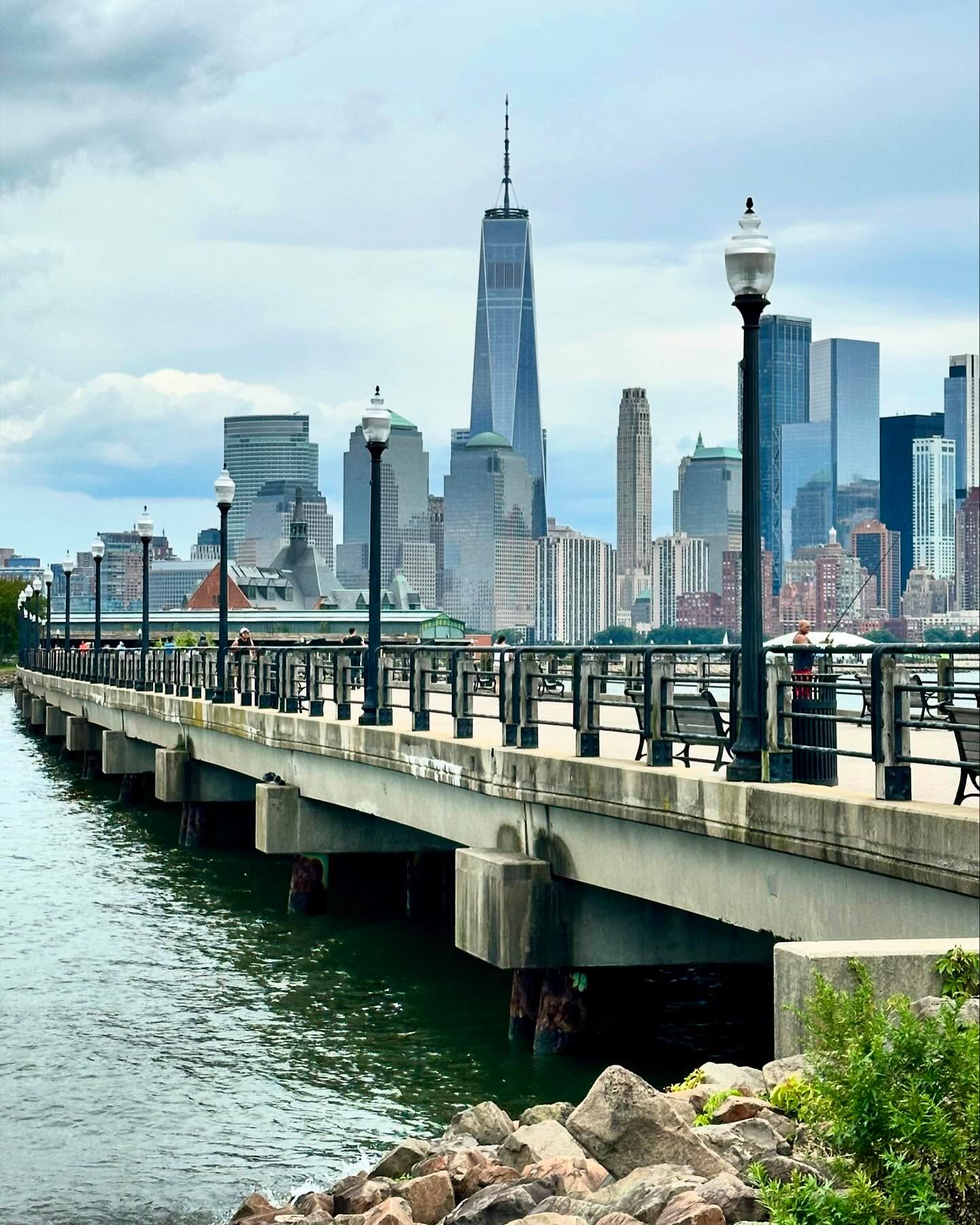 Liberty Walk is a 2-mile promenade in Liberty State Park, Jersey City. It connects picnic areas, playgrounds, the Nature Center, and the historic Central Railroad Terminal. The walk offers stunning views of the Hudson River, the Statue of Liberty, and Ellis Island. It’s perfect for a relaxing stroll