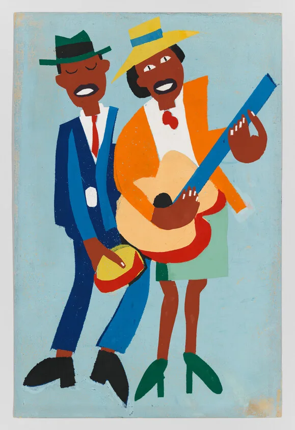 Two musicians wearing hats perform together, one strumming a guitar while the other holds a tambourine.